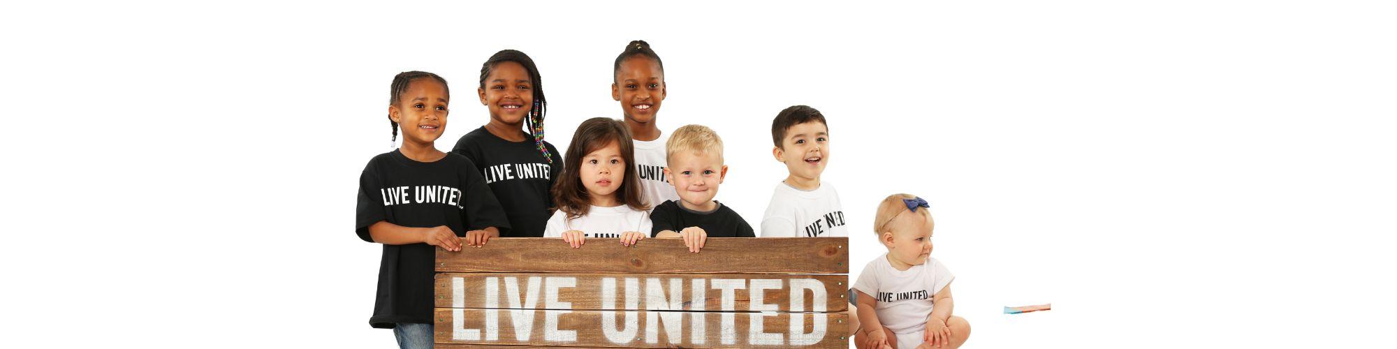 Children in LIVE UNITED shirts