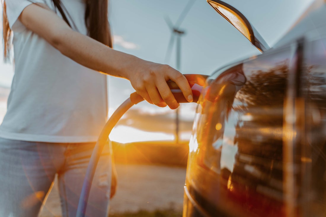 Woman getting gas.