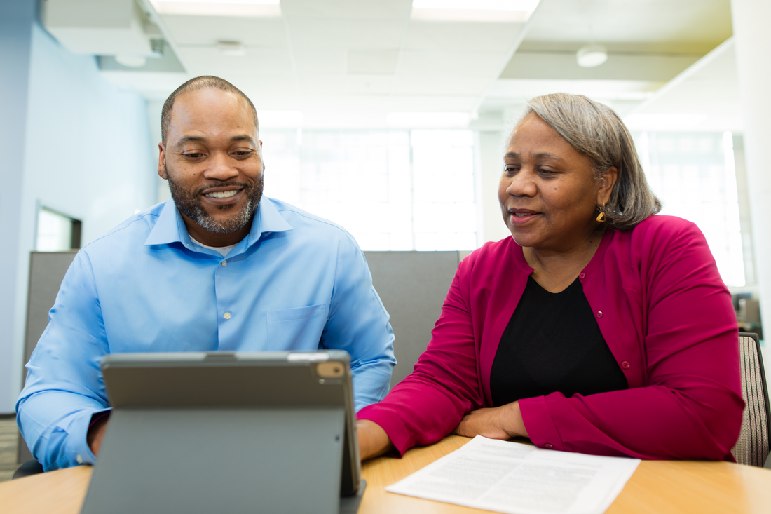 Tax preparer helping a client.