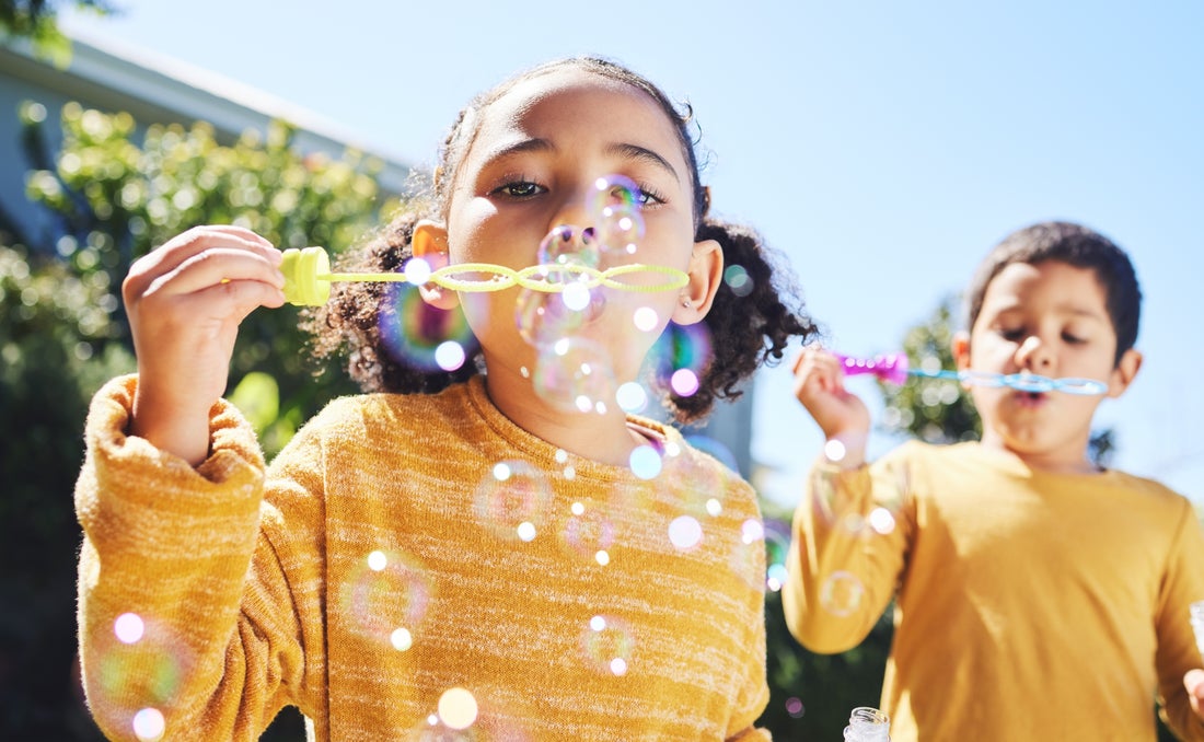 Girl blowing bubbles