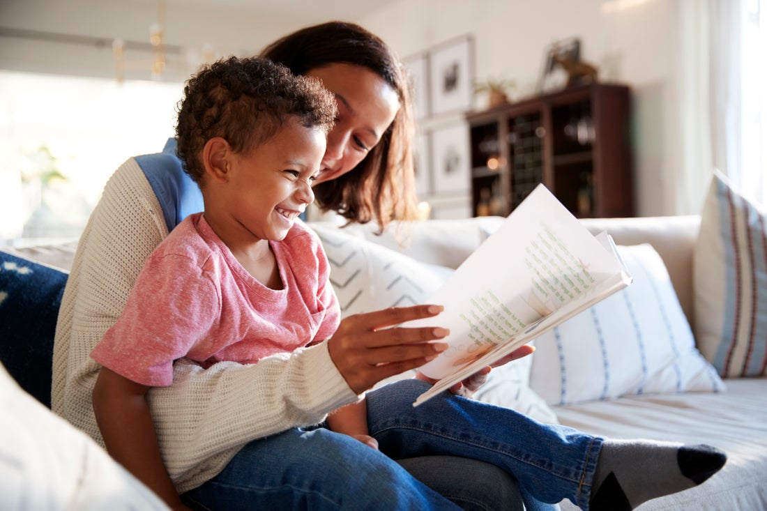 Mom reading to her son.