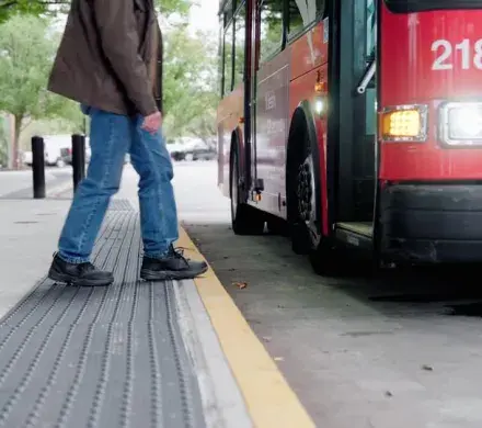 Man walking onto a bus.