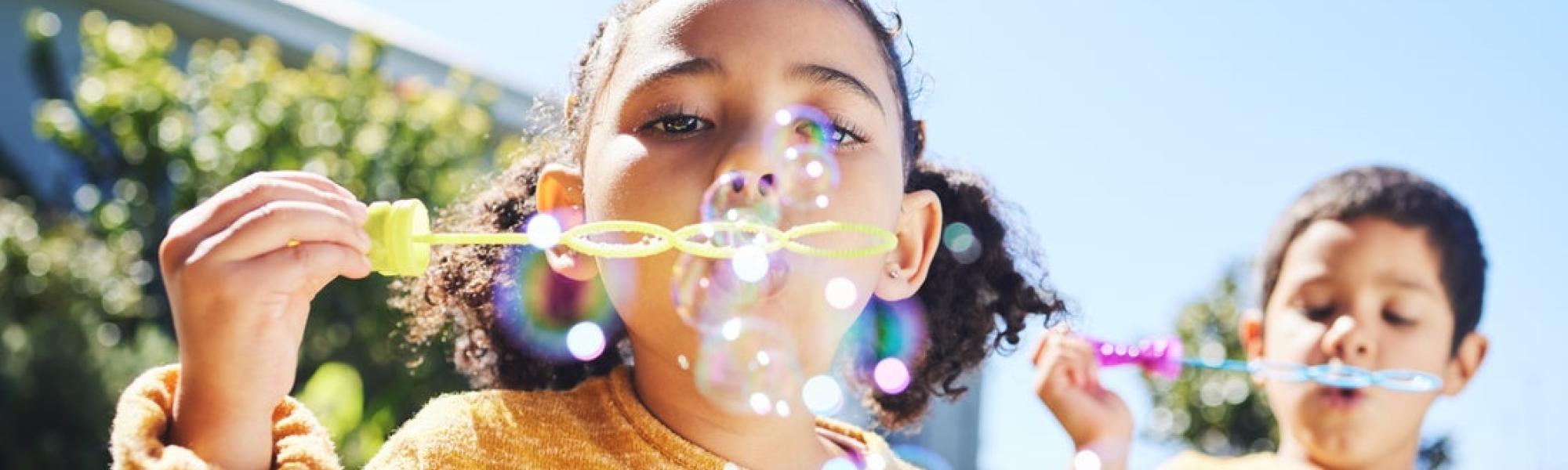 Girl blowing bubbles
