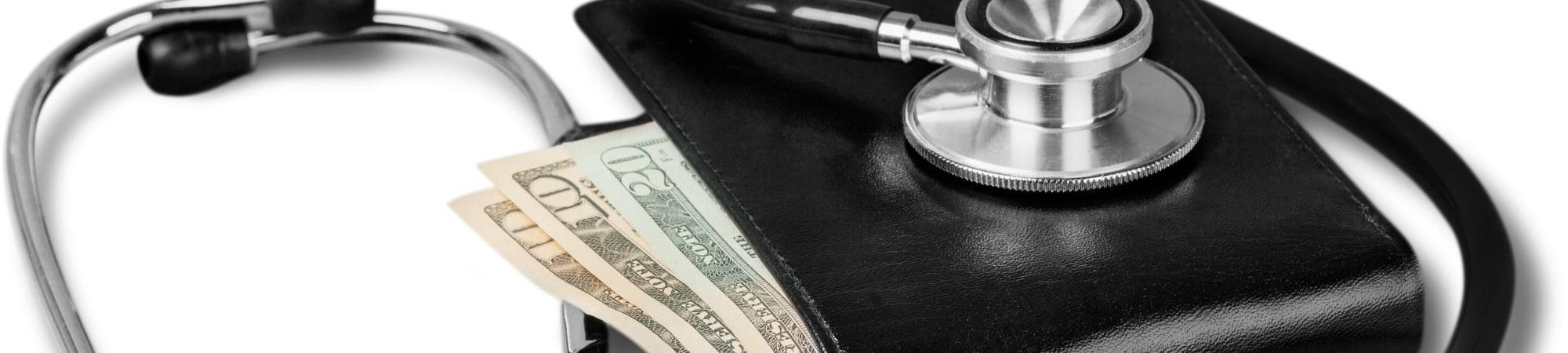 A black stethoscope wrapped around a black wallet