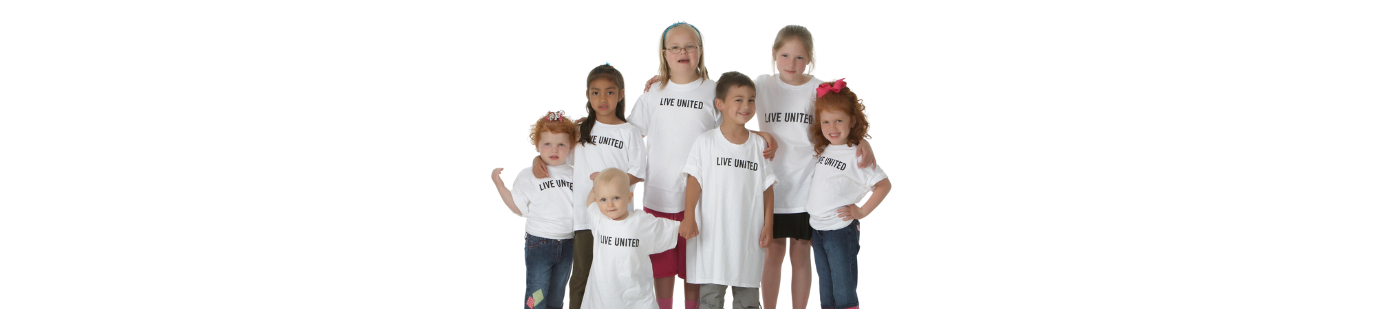 young children smiling in LIVE United T-shirts