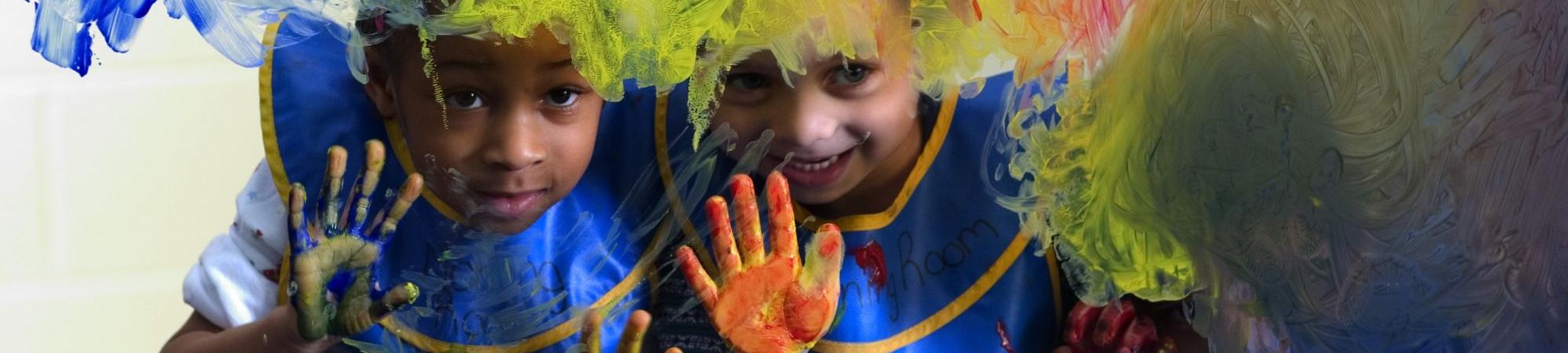 children finger painting