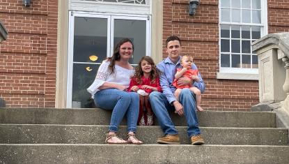 family sitting on steps