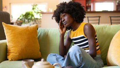 Women sitting looking stressed.