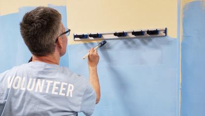 Volunteer Painting at Project Site.