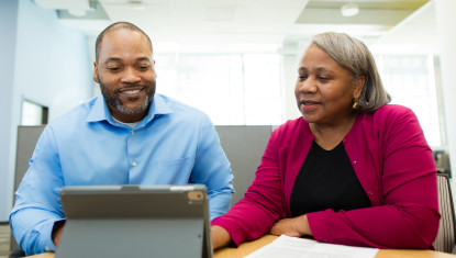 Volunteering helping a client with their taxes.