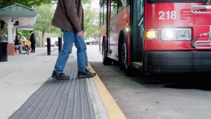 Man walking onto a bus.